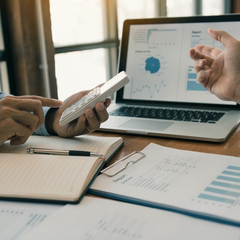 partnership-coworkers-analysis-strategy-with-discussing-a-financial-planning-graph.jpg